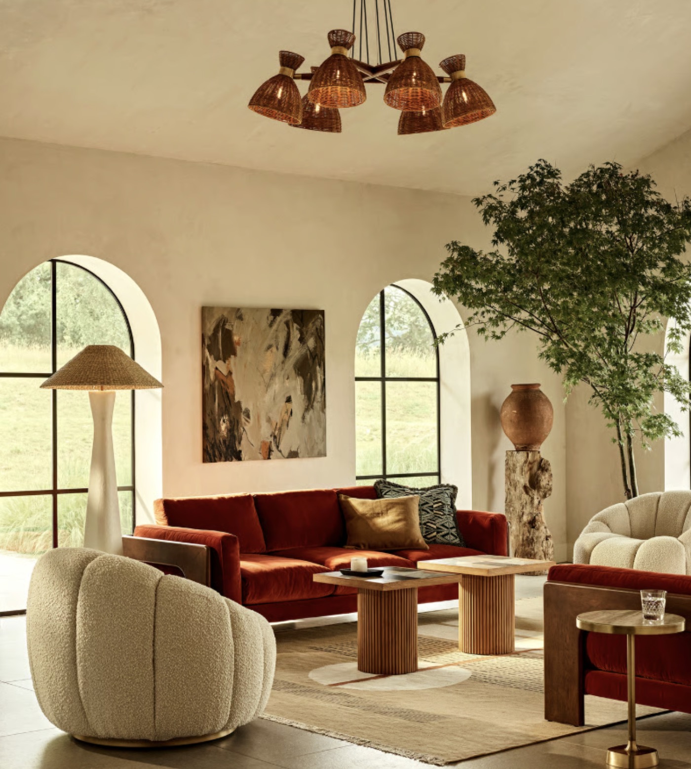 Curated living room with layered furniture, lighting and decor by Interiors by Toledo